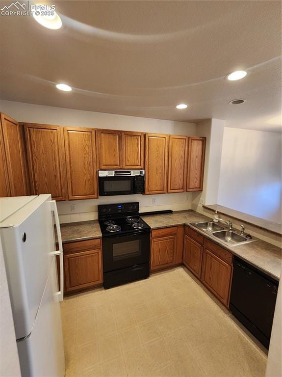 3928 Diamond Ridge Vw, Colorado Springs, CO 80918 - kitchen featuring black appliances, brown cabinets, a sink, and recessed lighting