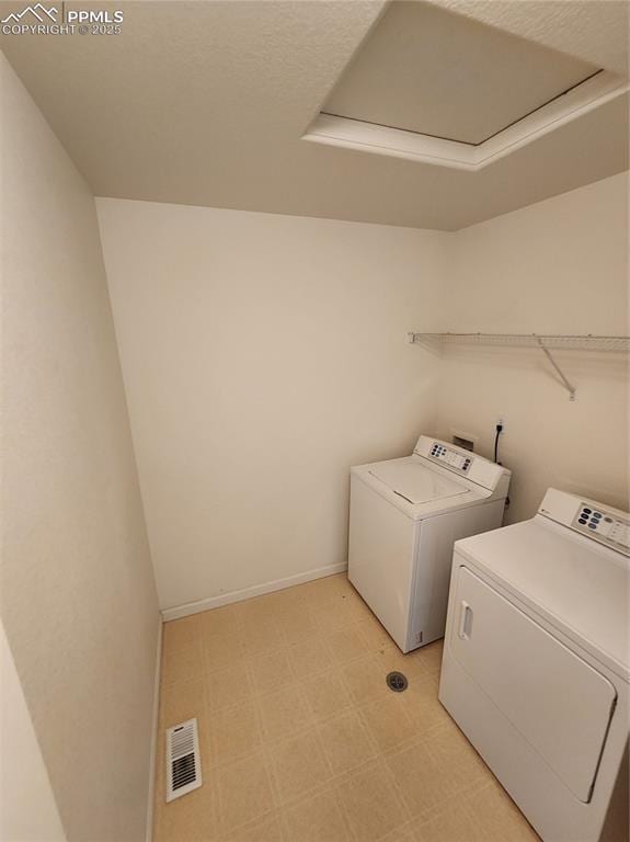 3928 Diamond Ridge Vw, Colorado Springs, CO 80918 - laundry area featuring light flooring, washer and clothes dryer, and baseboards
