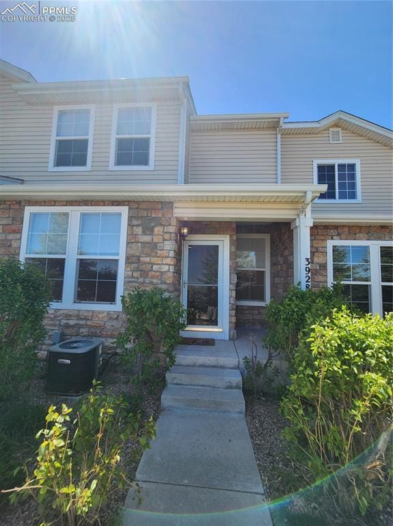 3928 Diamond Ridge Vw, Colorado Springs, CO 80918 - townhome / multi-family property featuring central AC unit and stone siding