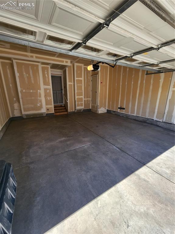 3928 Diamond Ridge Vw, Colorado Springs, CO 80918 - garage featuring a garage door opener