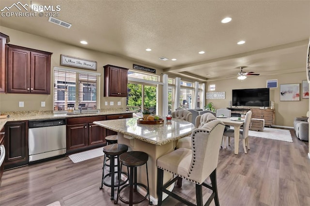 8356 Longleaf Ln, Colorado Springs, CO 80927 - kitchen featuring a textured ceiling, visible vents, recessed lighting, dishwasher, and open floor plan