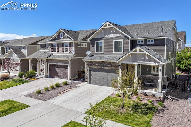 8356 Longleaf Ln, Colorado Springs, CO 80927 - view of front of property featuring an attached garage, covered porch, stone siding, concrete driveway, and board and batten siding