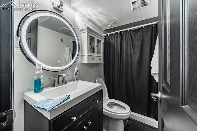 full bath featuring visible vents, a textured ceiling, toilet, and vanity