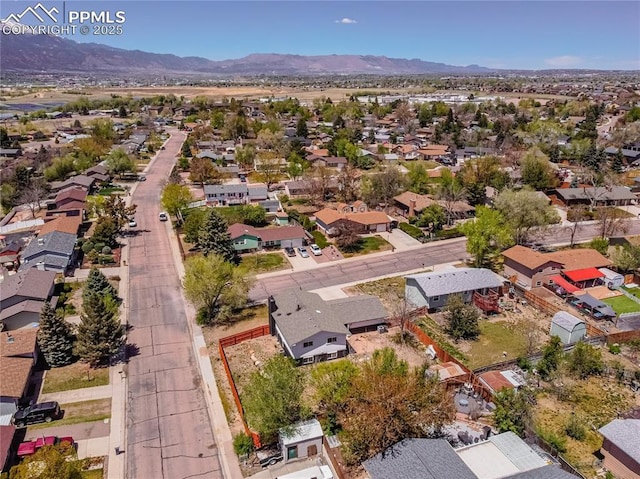 drone / aerial view featuring a residential view and a mountain view