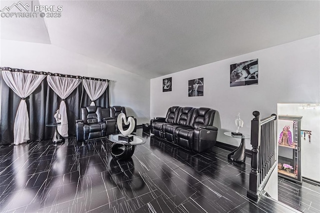 living room with baseboards and vaulted ceiling