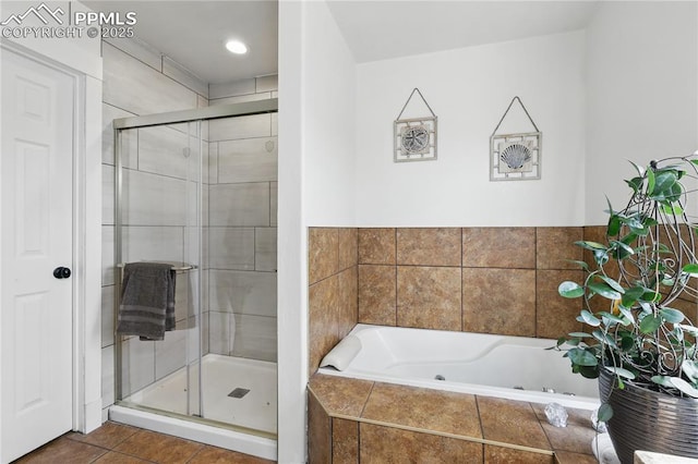 20420 Amanda Ct, Colorado Springs, CO 80908 - bathroom with a jetted tub, a stall shower, tile patterned floors, and recessed lighting