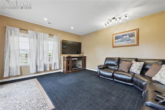 20420 Amanda Ct, Colorado Springs, CO 80908 - living room with baseboards, dark carpet, and recessed lighting