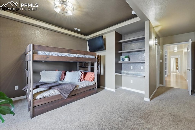 20420 Amanda Ct, Colorado Springs, CO 80908 - carpeted bedroom with baseboards and a raised ceiling