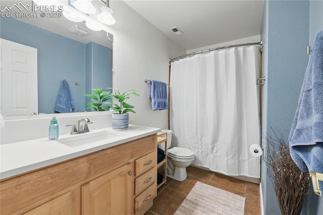 20420 Amanda Ct, Colorado Springs, CO 80908 - full bath featuring vanity, toilet, tile patterned flooring, and curtained shower