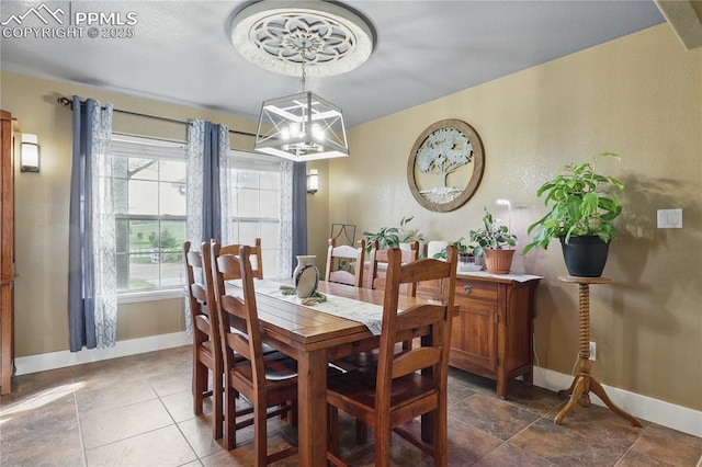 20420 Amanda Ct, Colorado Springs, CO 80908 - dining area featuring baseboards and a chandelier