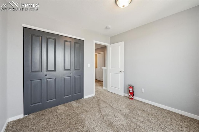 460 S 3rd Ave, Deer Trail, CO 80105 - unfurnished bedroom featuring carpet, baseboards, and a closet