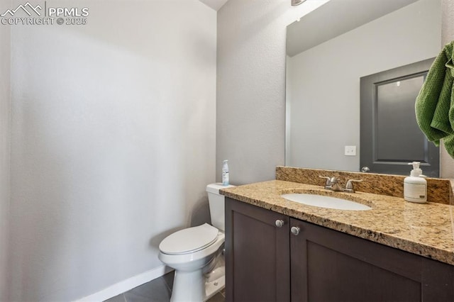 460 S 3rd Ave, Deer Trail, CO 80105 - half bath with vanity, toilet, and baseboards