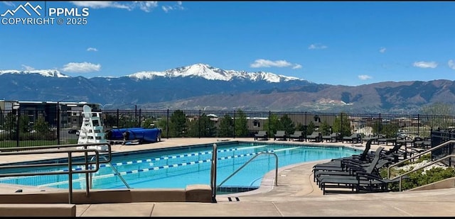 5019 Petrified Forest Trl, Colorado Springs, CO 80924 - community pool with a mountain view and a patio area