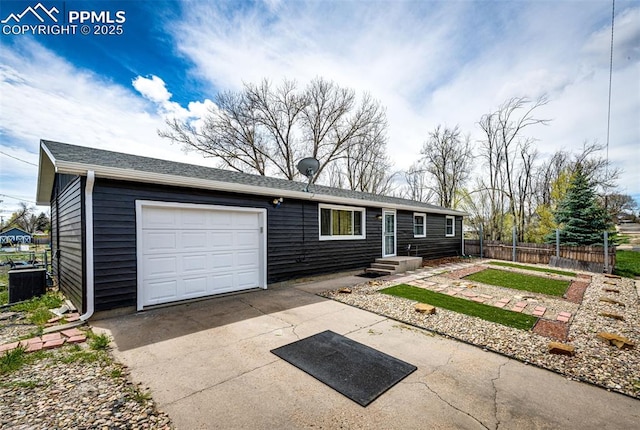 1085 6th St, Limon, CO 80828 - single story home featuring central AC, an attached garage, fence, and concrete driveway