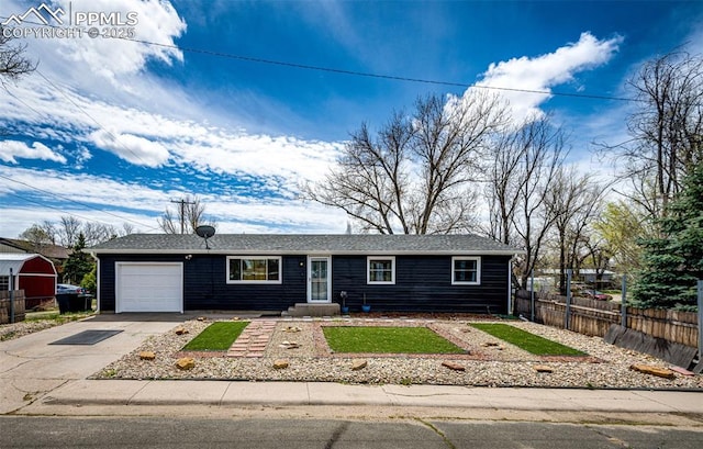 1085 6th St, Limon, CO 80828 - ranch-style home with a garage, fence, and driveway