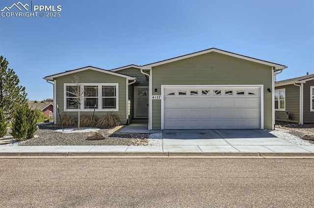 4157 Gray Fox Hts, Colorado Springs, CO 80922 - single story home featuring a garage and driveway
