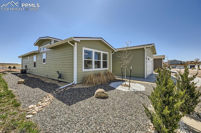 4157 Gray Fox Hts, Colorado Springs, CO 80922 - exterior space featuring an attached garage and central AC unit