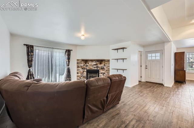 4157 Gray Fox Hts, Colorado Springs, CO 80922 - living room with baseboards, wood finished floors, and a fireplace