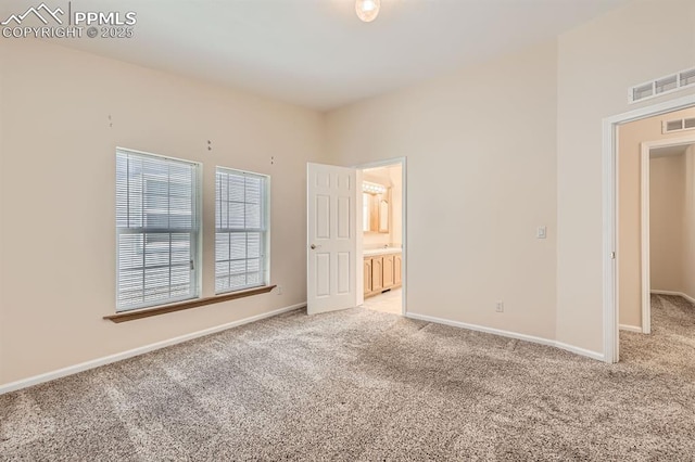 4578 Gray Fox Hts Unit 52, Colorado Springs, CO 80922 - unfurnished bedroom with light colored carpet and ensuite bath