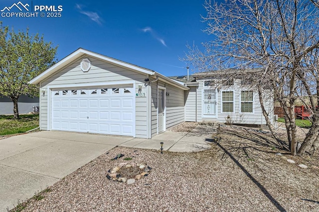 4578 Gray Fox Hts Unit 52, Colorado Springs, CO 80922 - ranch-style house with a garage and driveway