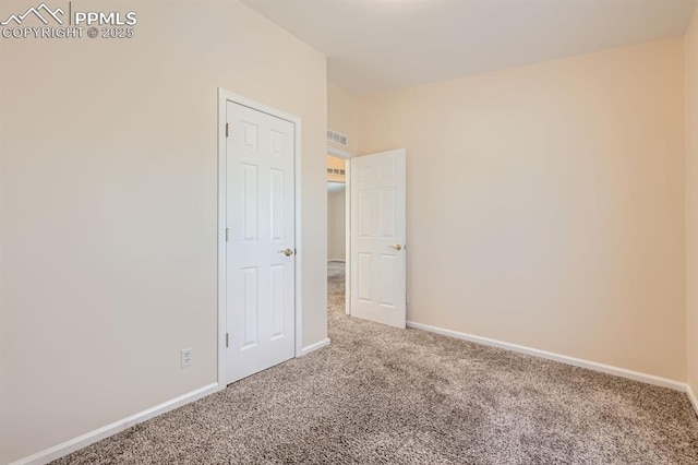 4578 Gray Fox Hts Unit 52, Colorado Springs, CO 80922 - unfurnished room with carpet floors and baseboards