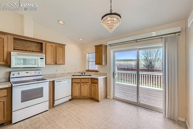 4578 Gray Fox Hts Unit 52, Colorado Springs, CO 80922 - kitchen featuring white appliances, light countertops, a chandelier, lofted ceiling, and recessed lighting