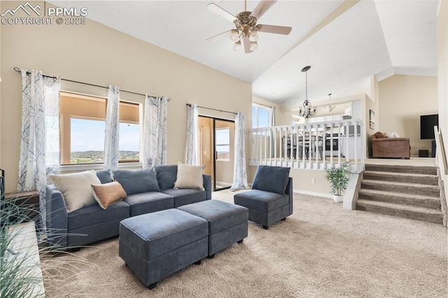 living area featuring carpet flooring, lofted ceiling, ceiling fan, a chandelier, and baseboards