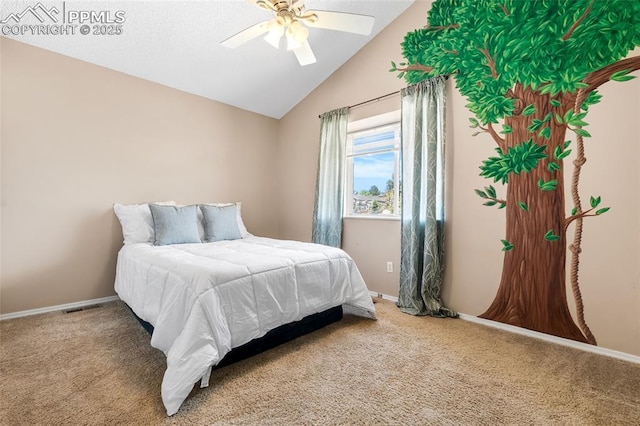 bedroom featuring lofted ceiling, carpet flooring, baseboards, and a ceiling fan