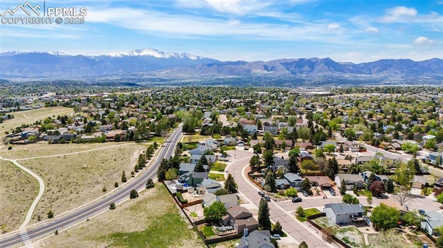 aerial view of residential area with a mountain backdrop