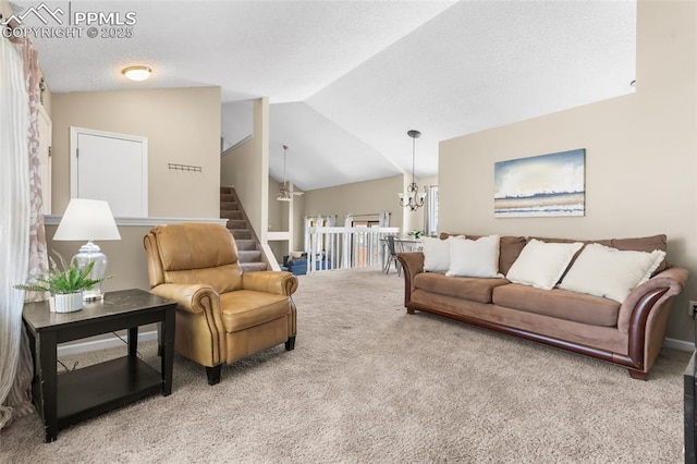 living area featuring lofted ceiling, carpet flooring, and stairway