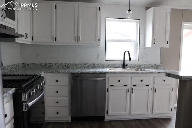 4663 Pine Marten Pt, Colorado Springs, CO 80922 - kitchen featuring gas range, stainless steel dishwasher, a sink, under cabinet range hood, and white cabinetry