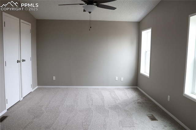 4663 Pine Marten Pt, Colorado Springs, CO 80922 - unfurnished bedroom with visible vents, a textured ceiling, carpet floors, and baseboards
