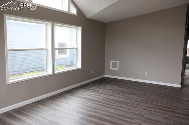 4663 Pine Marten Pt, Colorado Springs, CO 80922 - unfurnished room with baseboards, vaulted ceiling, and dark wood-style floors