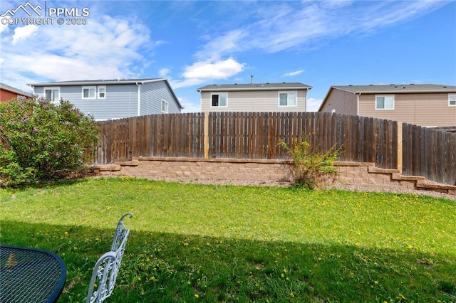view of yard featuring a fenced backyard