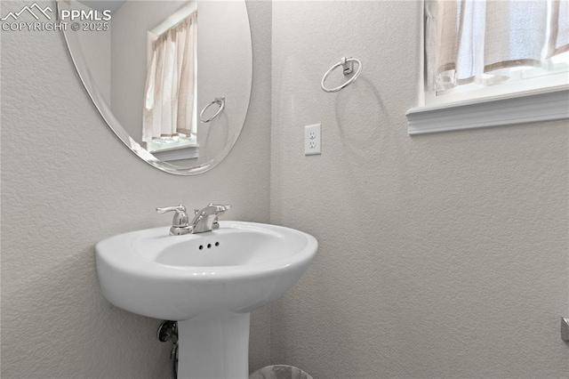 bathroom with a textured wall