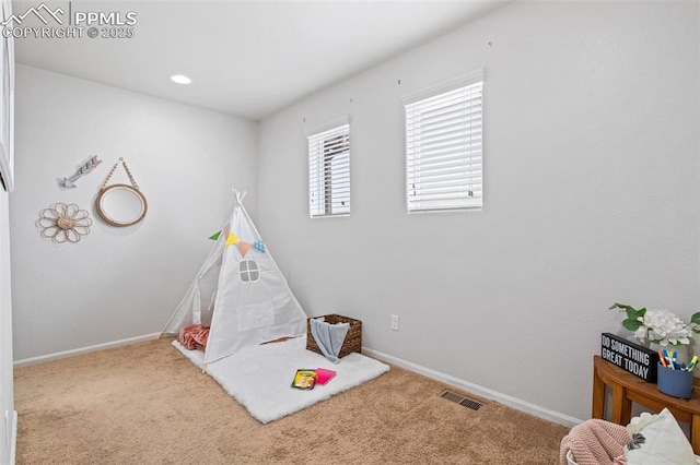 playroom with visible vents, carpet, and baseboards
