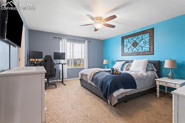 bedroom with light colored carpet, a ceiling fan, and baseboards