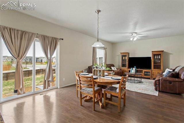 dining area with visible vents, a ceiling fan, and dark wood-style flooring