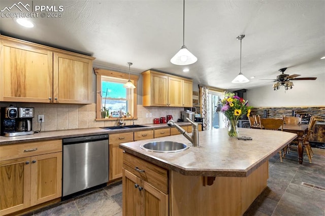 3235 S Meridian Rd, Colorado Springs, CO 80929 - kitchen with stainless steel dishwasher, a healthy amount of sunlight, and a sink