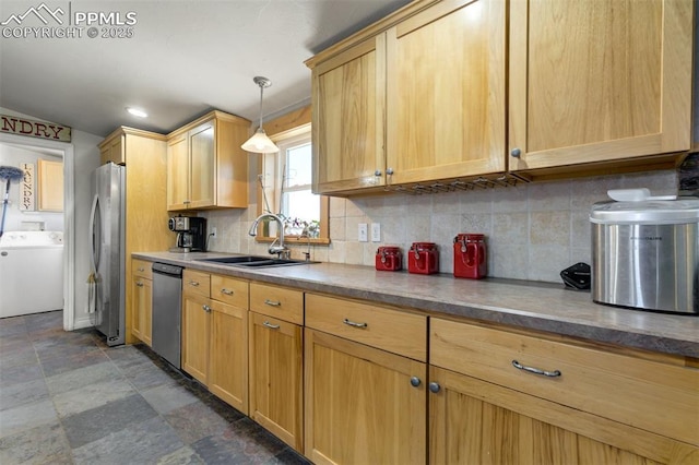 3235 S Meridian Rd, Colorado Springs, CO 80929 - kitchen featuring decorative backsplash, washer / clothes dryer, pendant lighting, appliances with stainless steel finishes, and a sink
