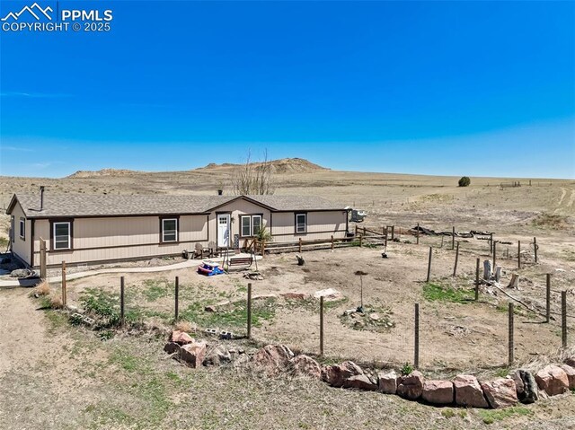 3235 S Meridian Rd, Colorado Springs, CO 80929 - view of front of home featuring fence and a mountain view