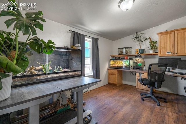 3235 S Meridian Rd, Colorado Springs, CO 80929 - office space with built in study area, lofted ceiling, and wood finished floors