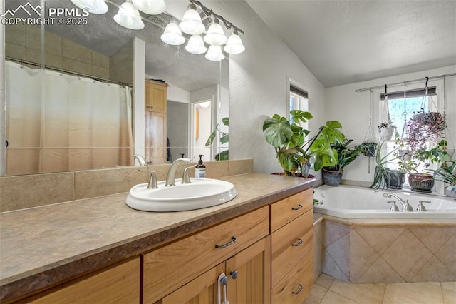 3235 S Meridian Rd, Colorado Springs, CO 80929 - bathroom with a healthy amount of sunlight, tile patterned floors, vanity, and lofted ceiling