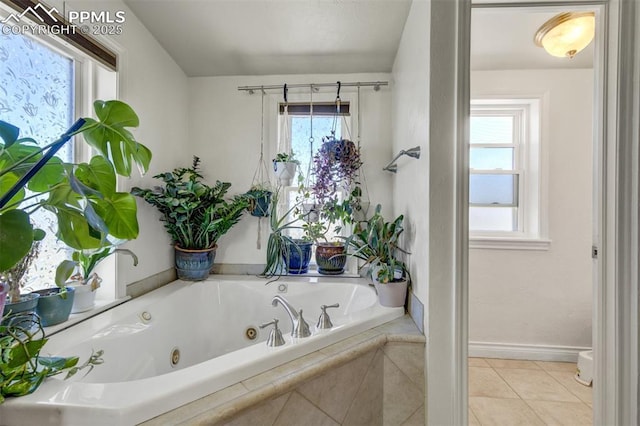3235 S Meridian Rd, Colorado Springs, CO 80929 - full bath featuring a jetted tub, baseboards, and tile patterned floors