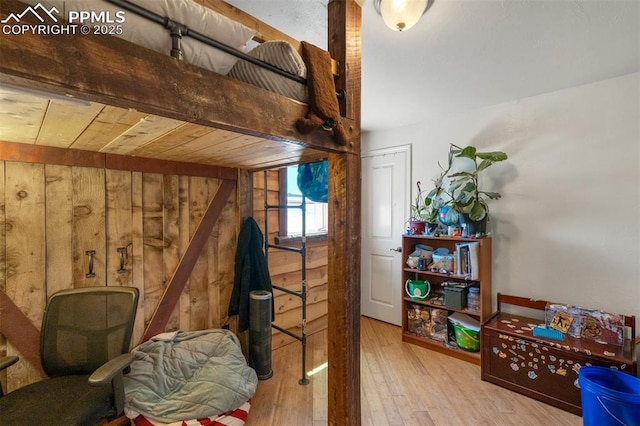3235 S Meridian Rd, Colorado Springs, CO 80929 - bedroom featuring wood walls and wood finished floors