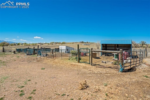 3235 S Meridian Rd, Colorado Springs, CO 80929 - view of yard featuring an outbuilding, an exterior structure, and a rural view