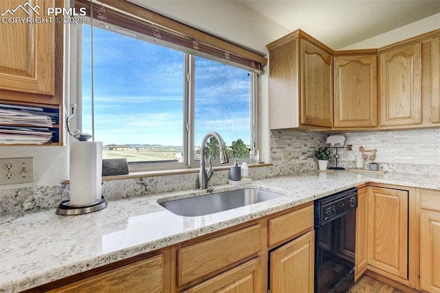 7850 Wilderness Dr, Colorado Springs, CO 80908 - kitchen featuring black dishwasher, a sink, light stone counters, tasteful backsplash, and light brown cabinets