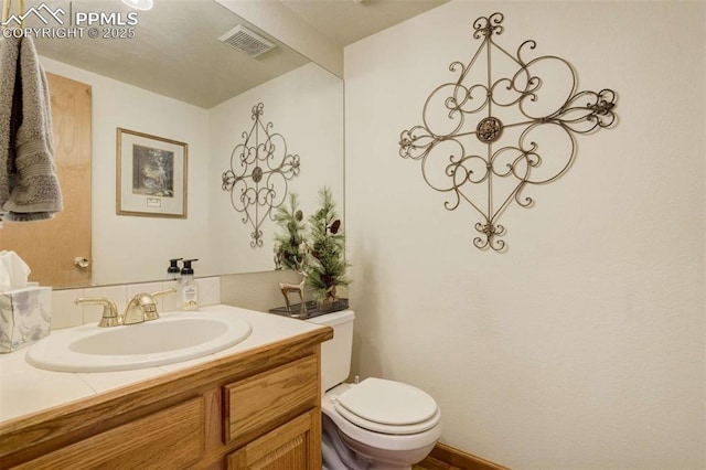 7850 Wilderness Dr, Colorado Springs, CO 80908 - half bathroom with toilet and vanity