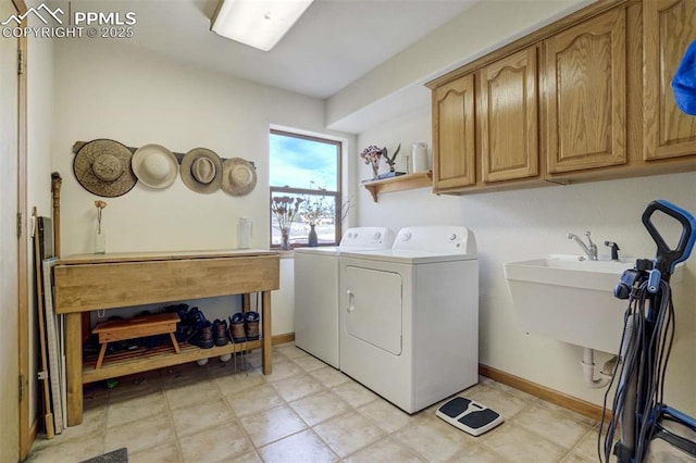 7850 Wilderness Dr, Colorado Springs, CO 80908 - clothes washing area with cabinet space, independent washer and dryer, and baseboards