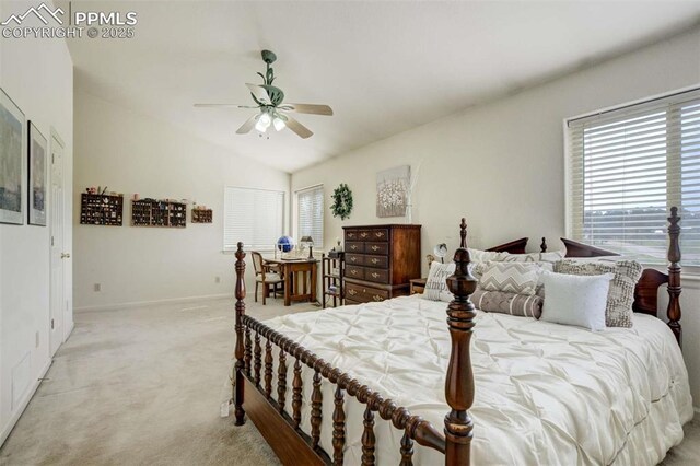 7850 Wilderness Dr, Colorado Springs, CO 80908 - bedroom with lofted ceiling, light carpet, multiple windows, baseboards, and a ceiling fan